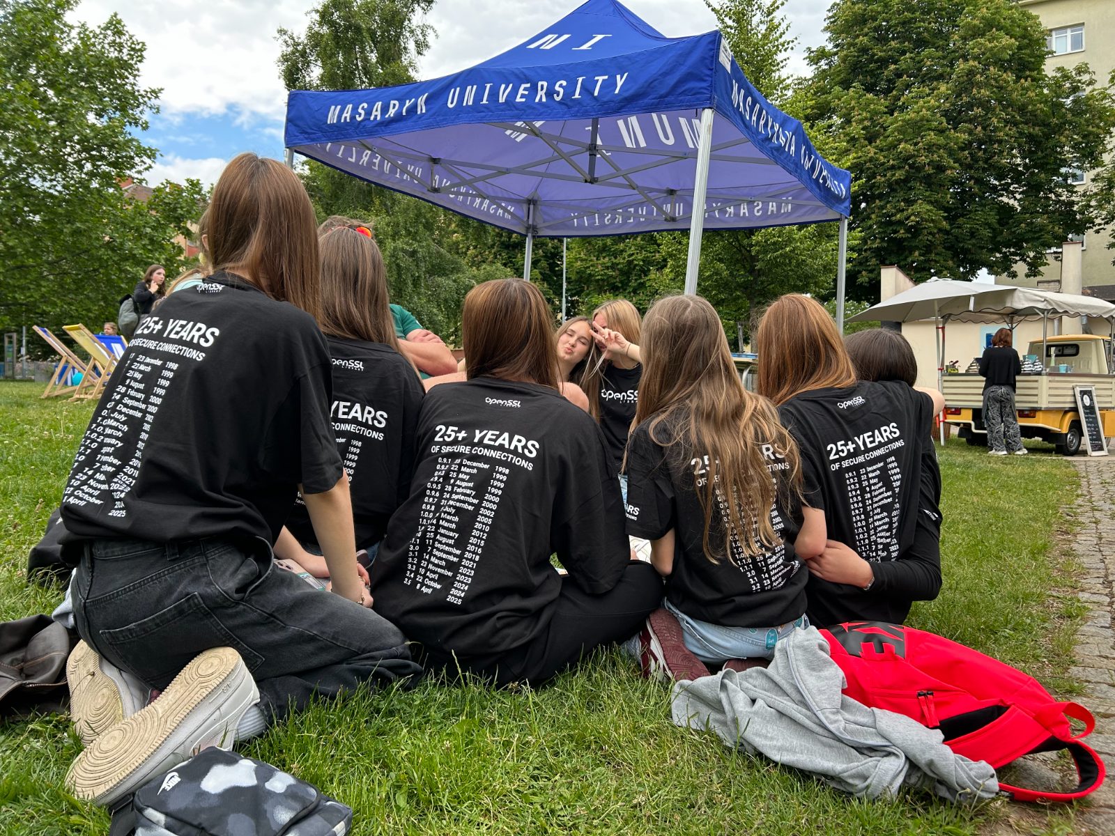 A group of students wearing the OpenSSL Library t-shirts