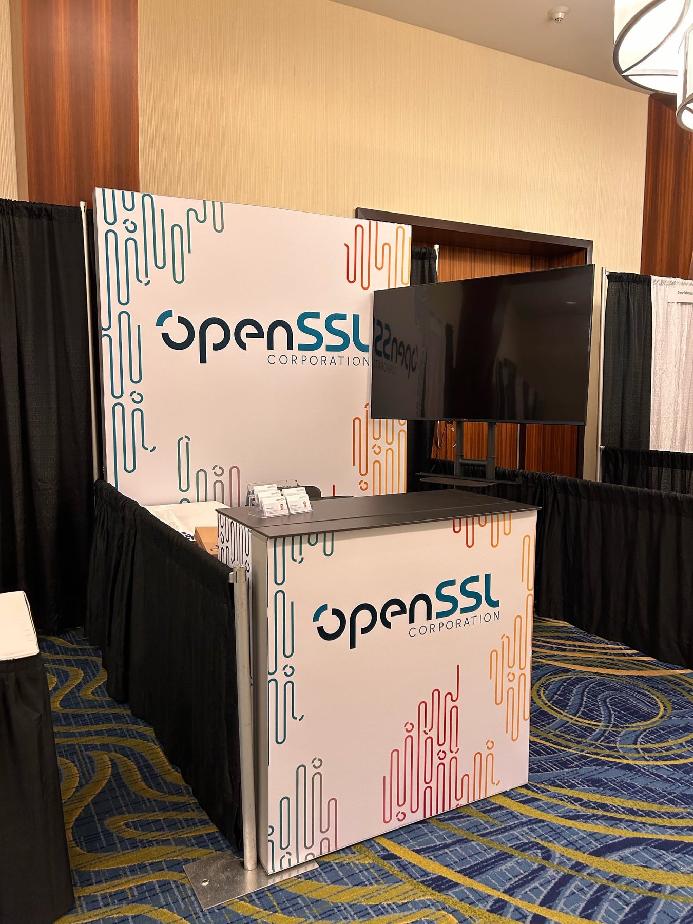 The finished OpenSSL Corporation booth at ICMC26
