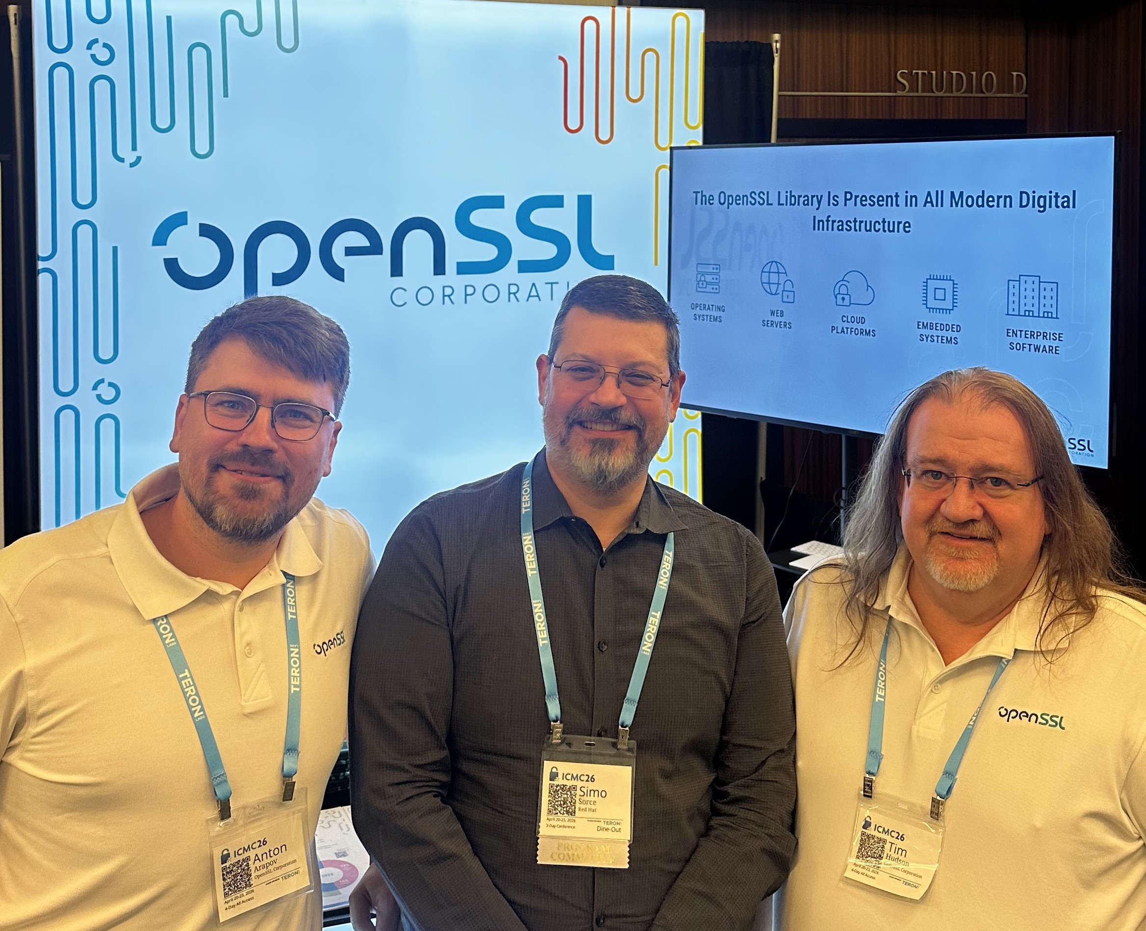 Anton Arapov, Simo Sorce of Red Hat, and Tim Hudson at the OpenSSL booth after the talk.